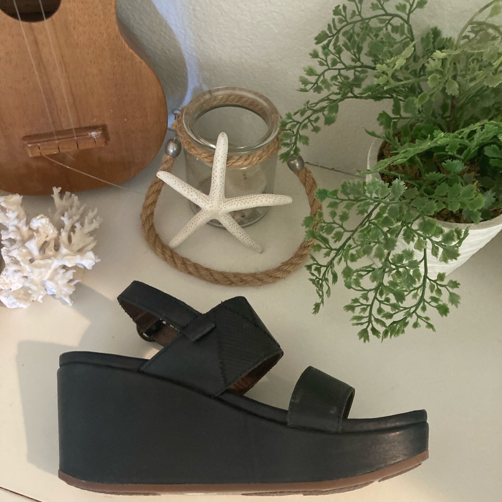 Olukai size 7 black leather  wedge shoes. Brand new never worn.